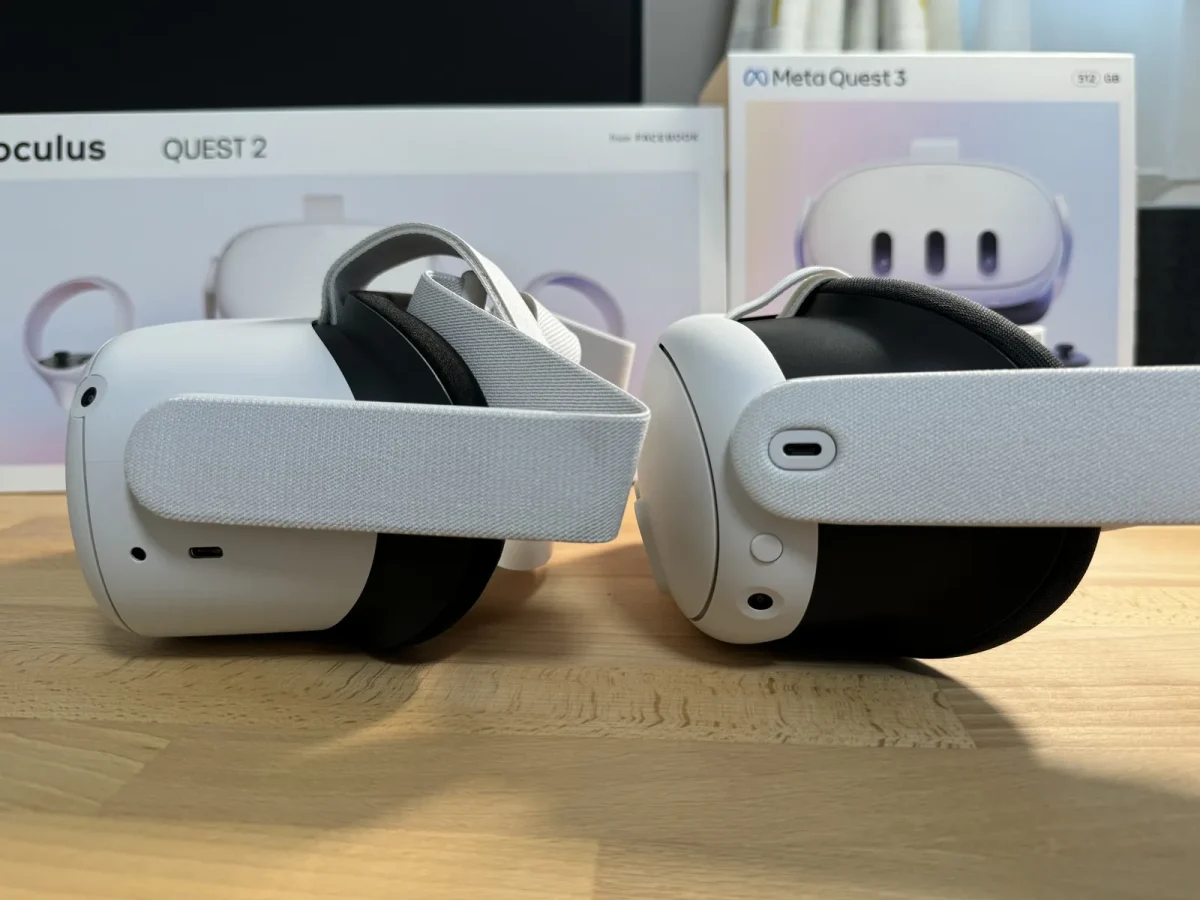 Oculus Quest 2とMeta Quest 3の実機が並び、背景にそれぞれの化粧箱が立てられている。左の箱には当時の名称「oculus QUEST 2 from FACEBOOK」の表記がある